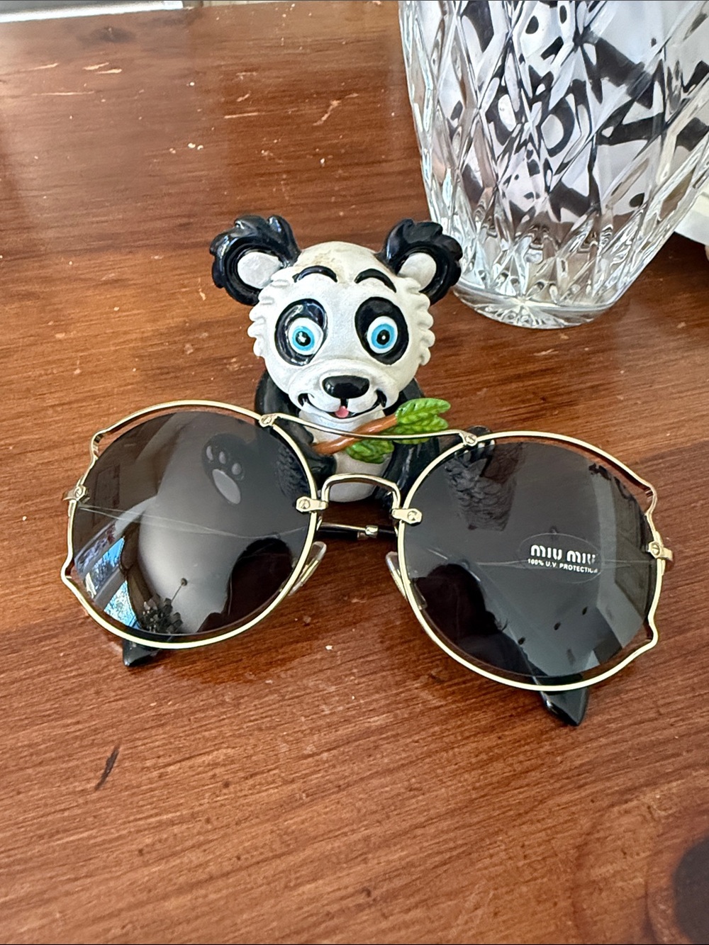 Miu Miu Gold Frame Sunglasses with Black Lenses